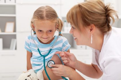 Kid getting checkup from doctor